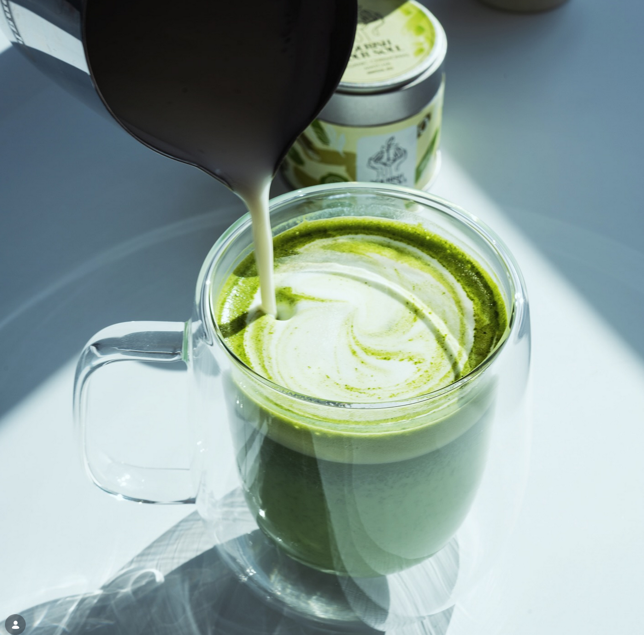 Barista pouring ceremonial matcha latte at SentirCafé